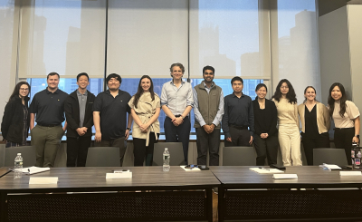The Assured Guaranty team members posing for a photo after the public speaking class.
