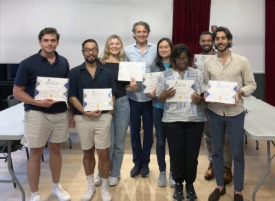 A great public speaking class with the group holding their certificates.